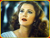 Lynda as Rita Hayworth with red hair and wwearing bron contact lenses.