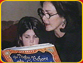 Lynda reading "The Night Before Christmas To Her Daughter".