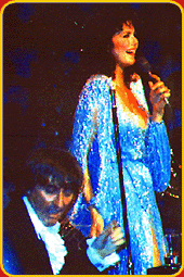 Lynda Carter with Johnny Harris on stage.